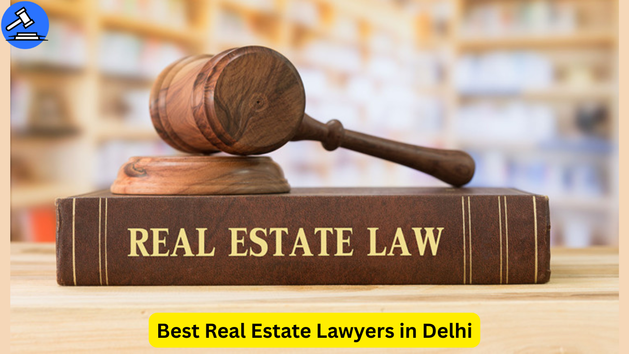 Wooden judge gavel resting on a law book titled 'Real Estate Law' with blurred law library in background, representing the best real estate lawyers in Delhi.